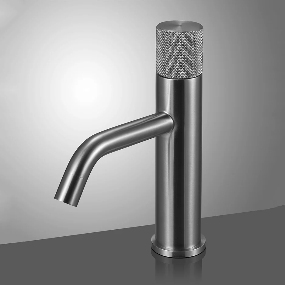 Silver-tone basin faucet with a textured control.