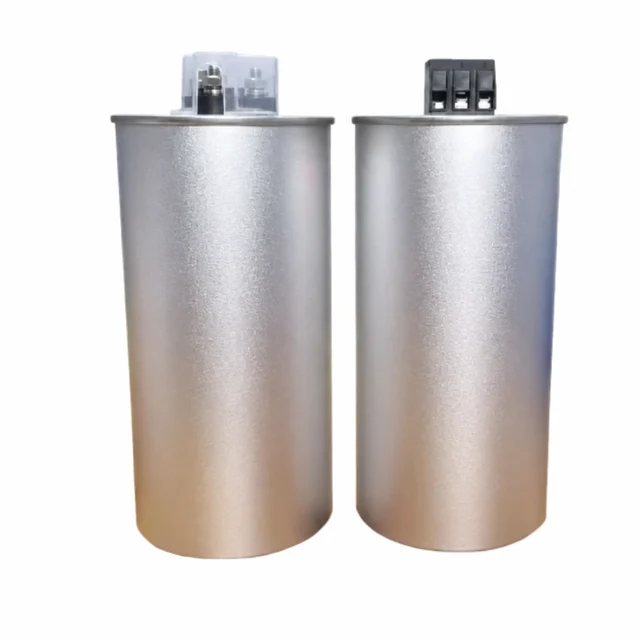 Two cylindrical capacitors with different terminal covers.